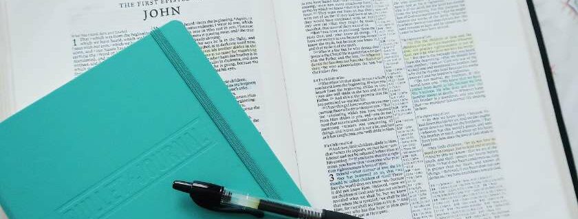 green notebook and a bible and 444 meaning bible