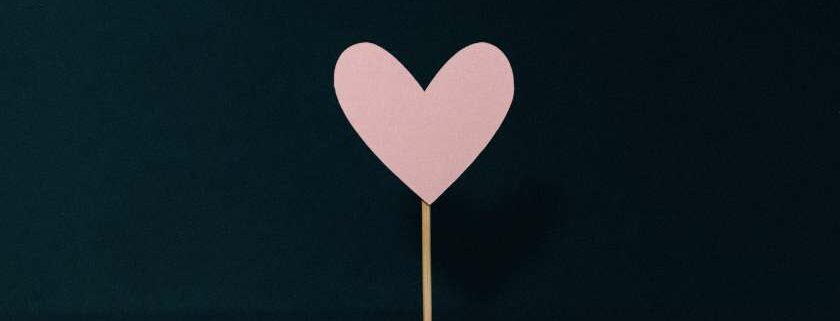 pink heart on stick and god heals the broken hearted