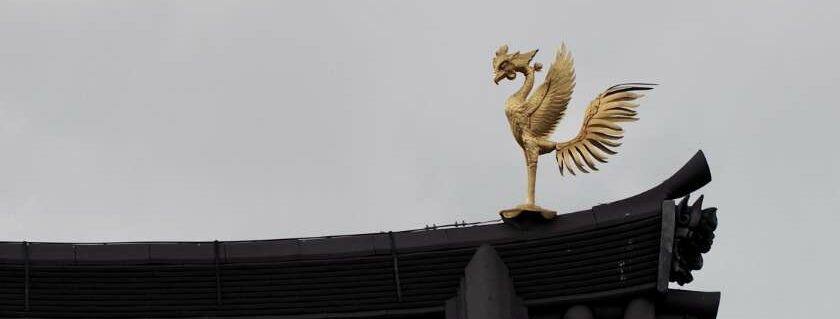 bird statue on top of roof and phoenix meaning bible