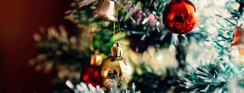 gold and red christmas balls in christmas tree and christmas meaning in bible