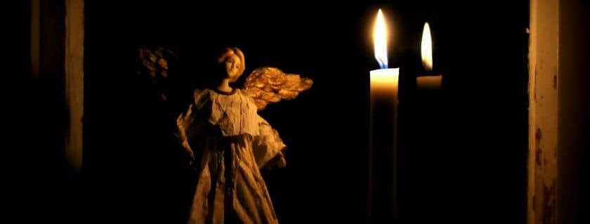 angel and candle on dark and angel of god prayer
