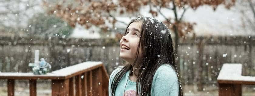 girl looking up in the snow and mysteries of god