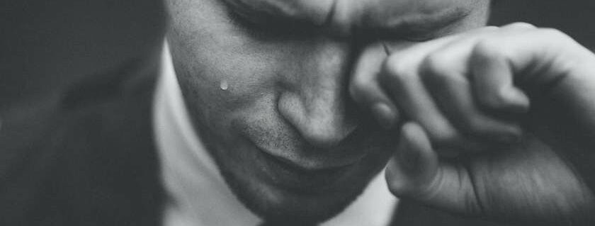 man crying wiping tears and god collects our tears