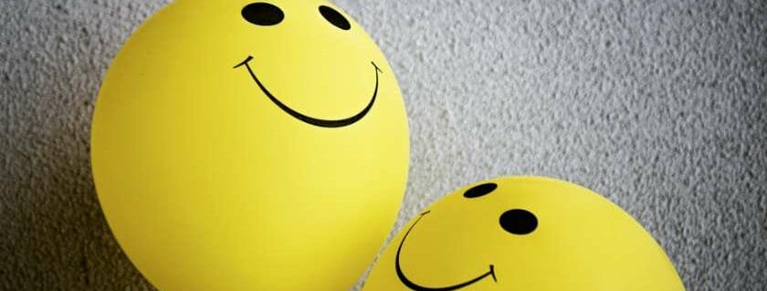 yellow smiley emoji balloon and does god have a humor