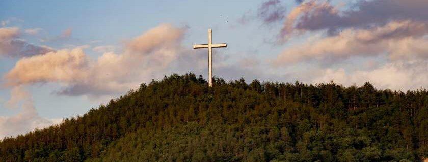 cross on mountain and reasons to believe in god