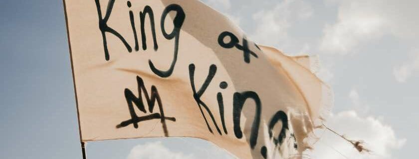 king of my kings written on white flag and god is king