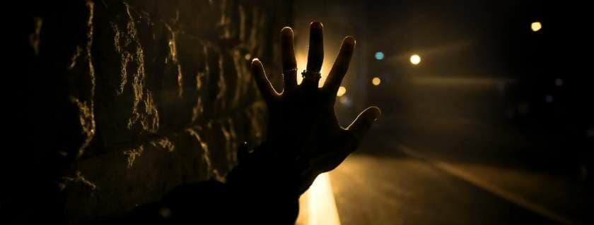 silhouette of a hand with lights and prayer for immediate help from god