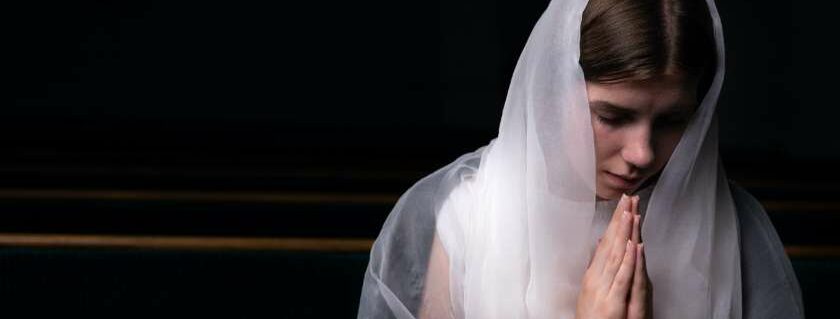 woman praying white veil and seek ye first the kingdom of god meaning