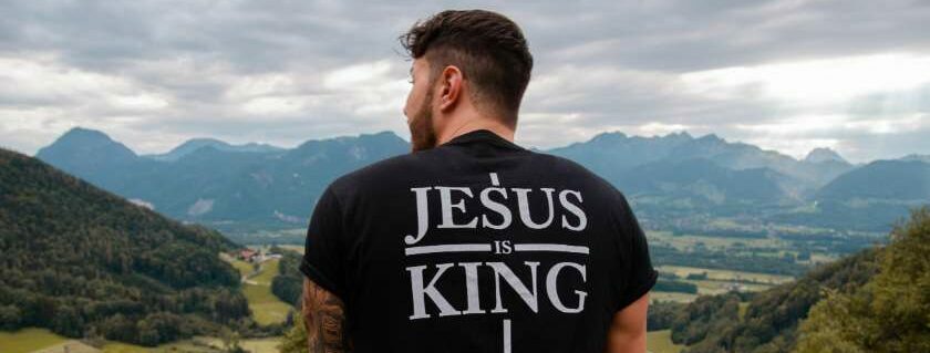 guy wearing black shirt jesus is king