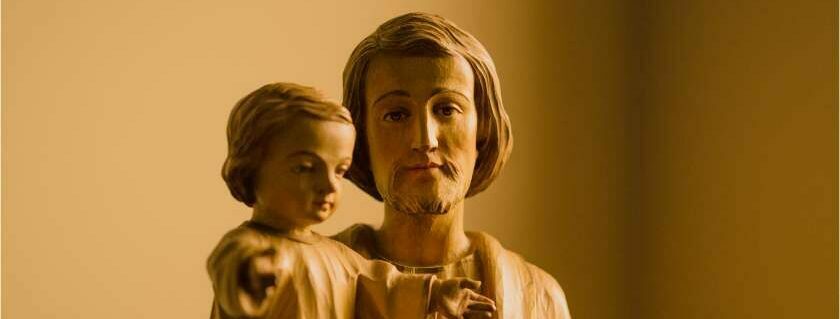 joseph carrying baby jesus statuette figurine