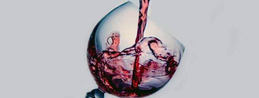 red wine poured into wine glass