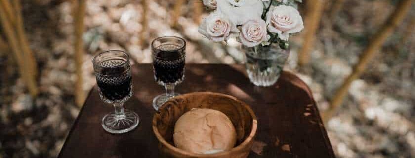 two wines with bread and flowers