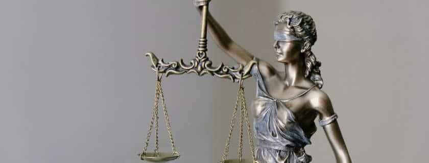 the justice lady holding the scale blindfolded