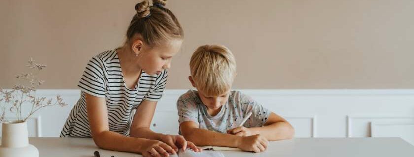 little girl helping a boy with homework and abcs of salvation