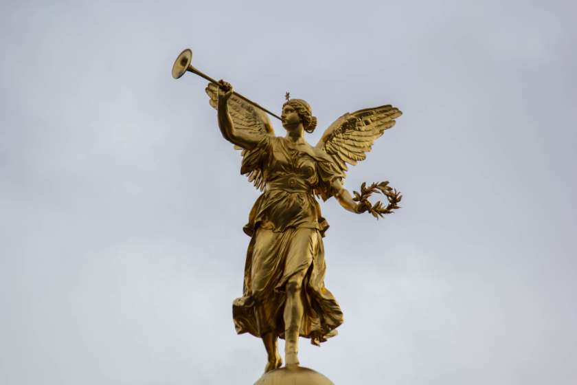 gold angel statue blowing a horn and horn of salvation